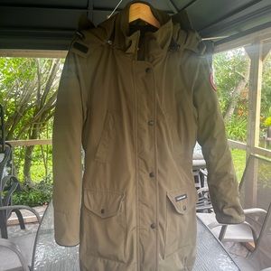 The brand is Canada Goose. Size small. Olive colour.